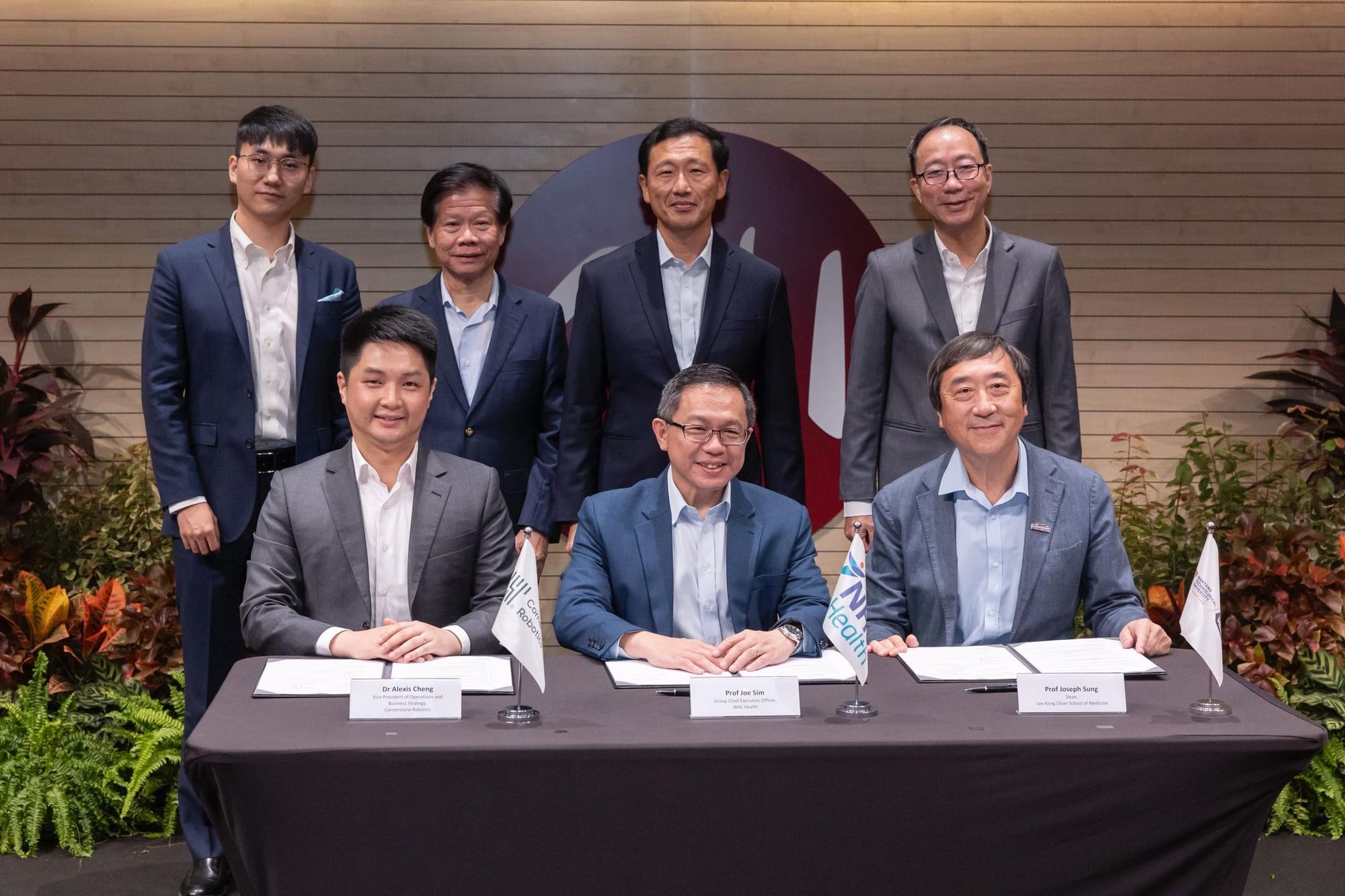 Front row (from Left): Alexis Cheng, Co-Founder & Vice President of Operation and Business Strategy of Cornerstone Robotics, Professor Joe Sim, Group CEO, NHG, Professor Joseph Sung, Dean, Lee Kong Chian School of Medicine; Back row (from left): Jerry Wang, Co-Founder, CTO & COO of Cornerstone Robotics, Professor Lam Khin Yong, Vice President (Industry), Mr. Ong Ye Kung, Minister of Health and Coordinating Minister for Social Policy, Mr. Tan Tee How, Chairman, NHG